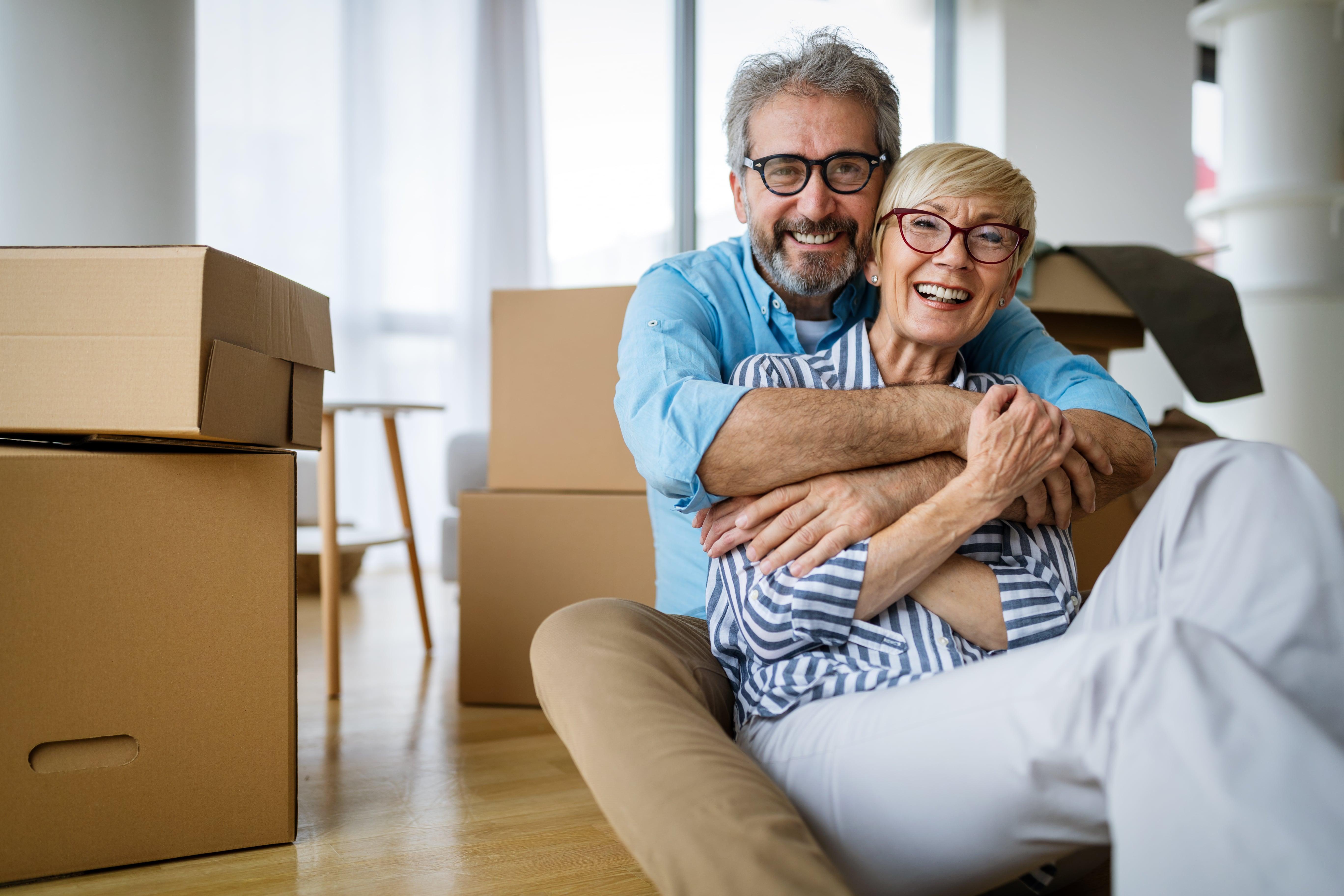 Couple Packing Boxes Moving Downsizing Clutter Removal Removalist