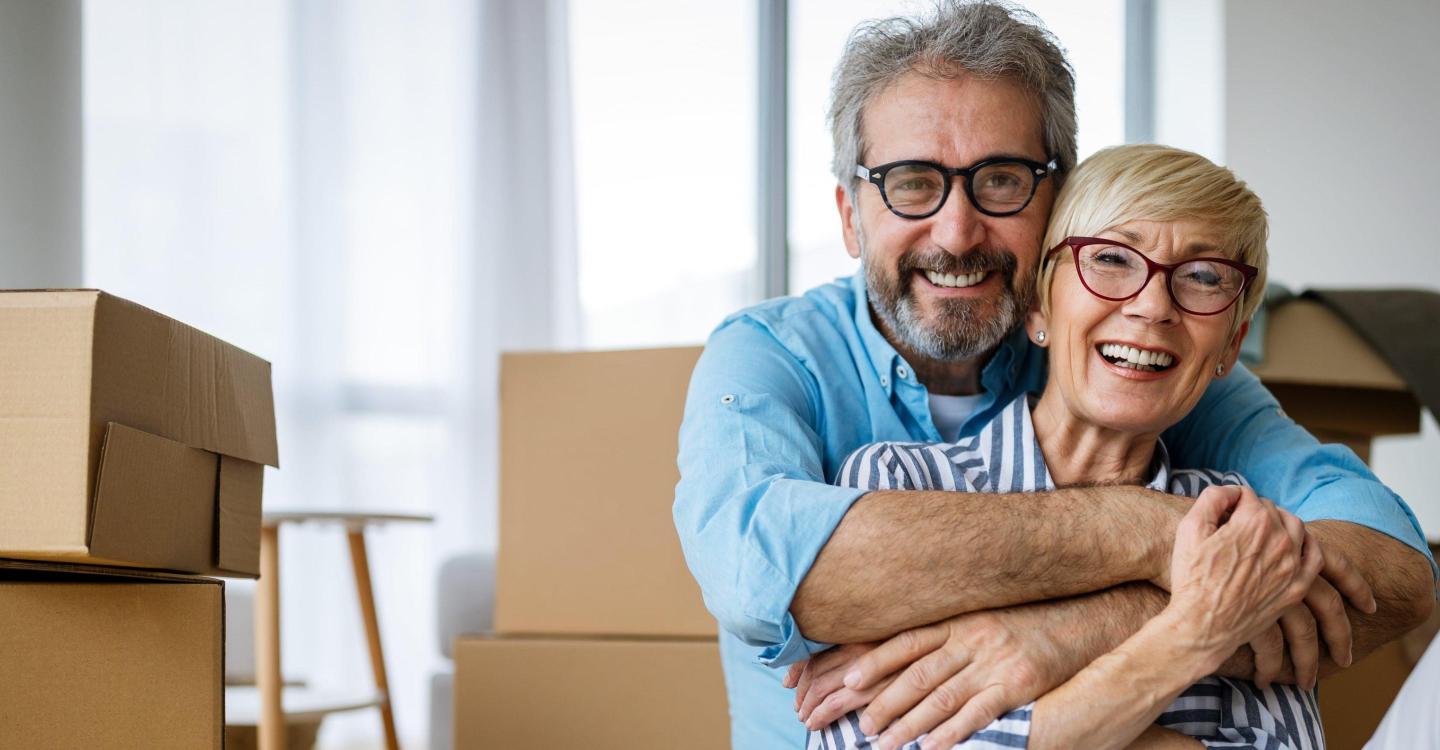 Couple Packing Boxes Moving Downsizing Clutter Removal Removalist